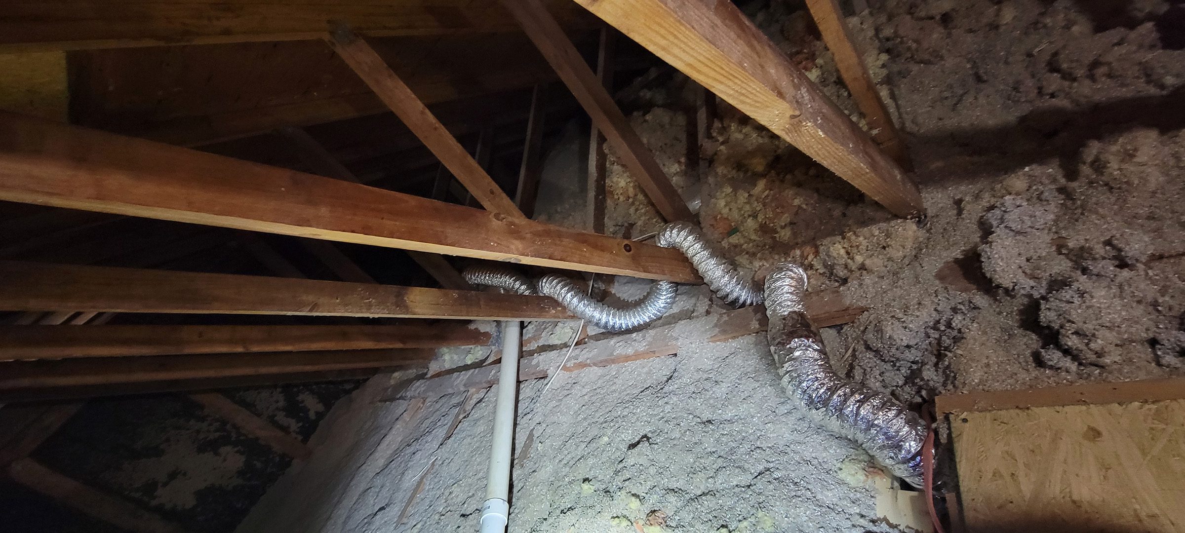 damaged dryer vent in the attic